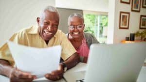 Senior couple signing advance directives and creating advance care planning